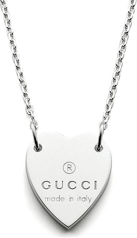 Gucci Sterling Silver Trademark Bracelet with Heart Pendant.